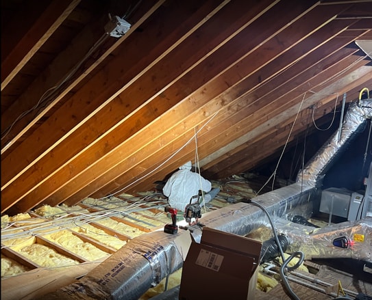 Certified technician performing mold removal in a Passaic County attic